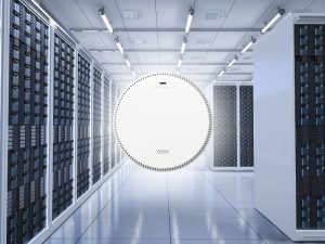 Air quality tests device in a server room with data racks in the background.